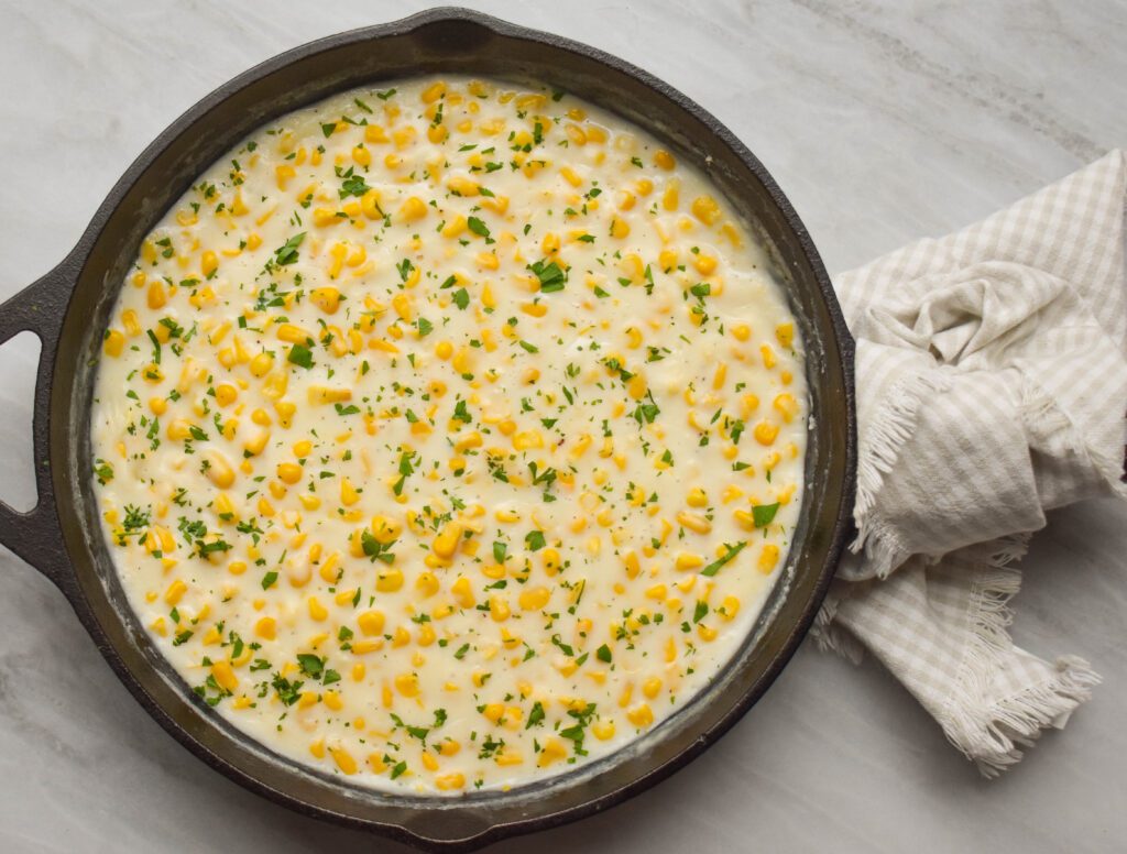 low-FODMAP creamed corn in skillet close up sideways