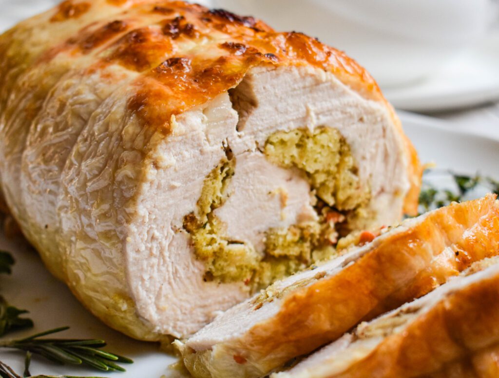 low-FODMAP rolled stuffed turkey with stuffing close up cut