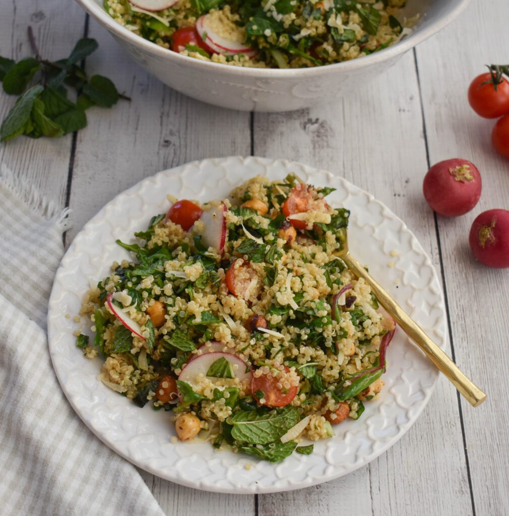 low fodmap warm quinoa salad on plate with bowl