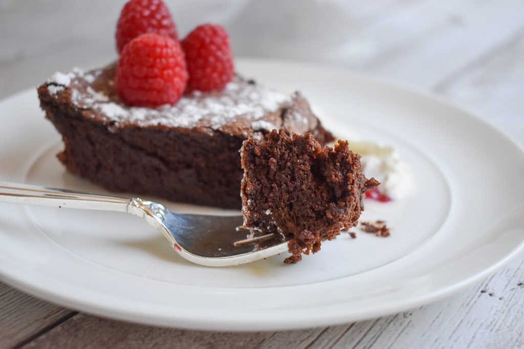 flourless chocolate cake on plate